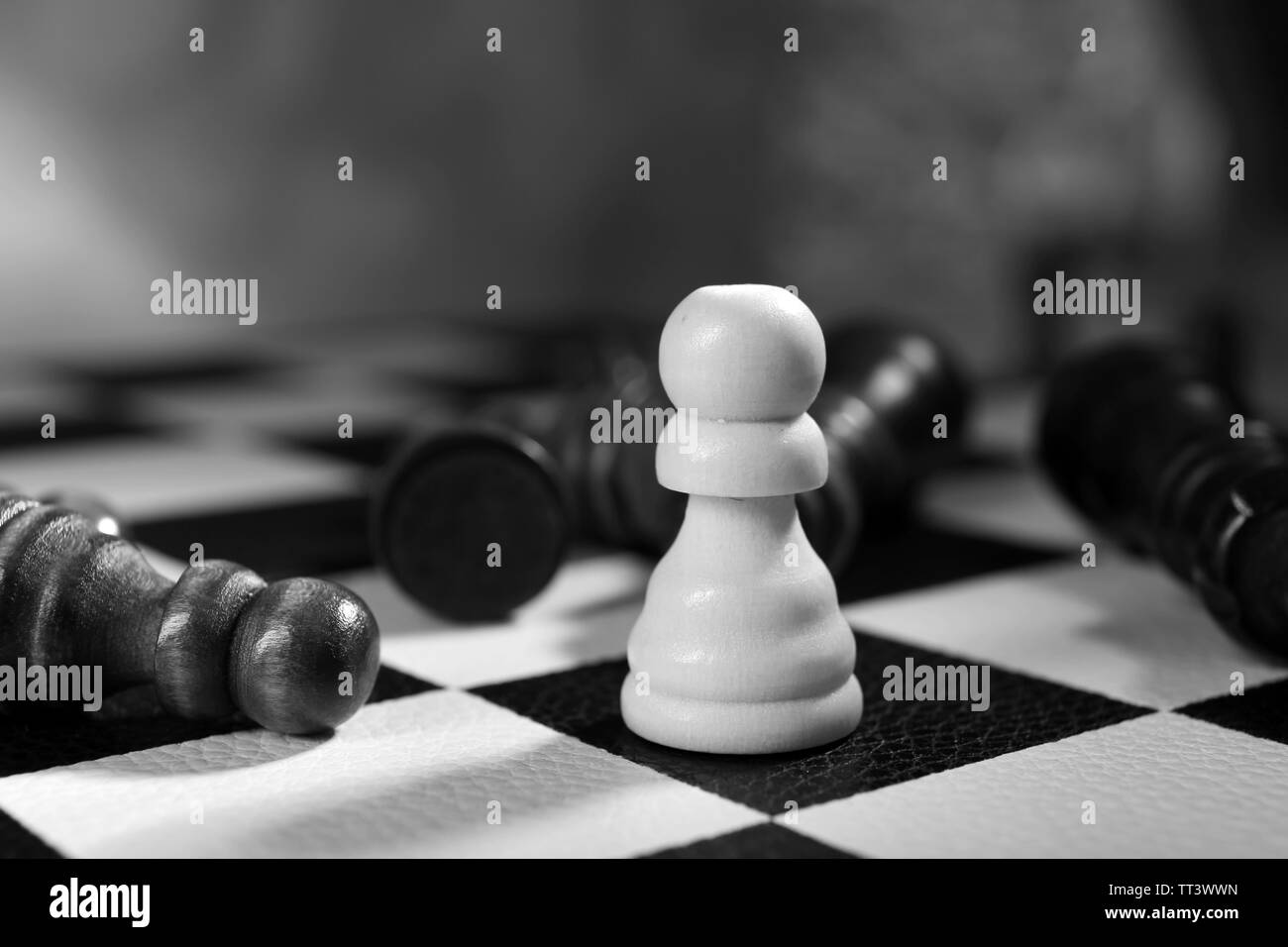 Chess board with chess pieces on grey background Stock Photo