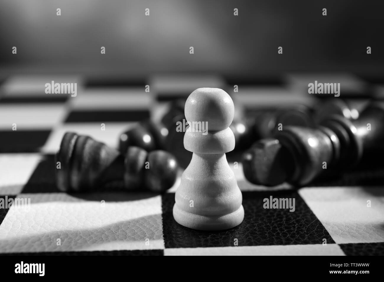 Chess board with chess pieces on grey background Stock Photo