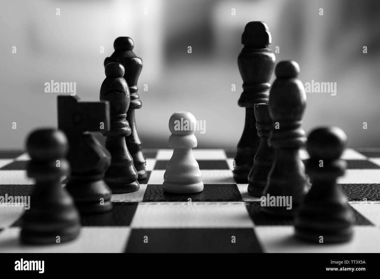 Chess board with chess pieces on grey background Stock Photo