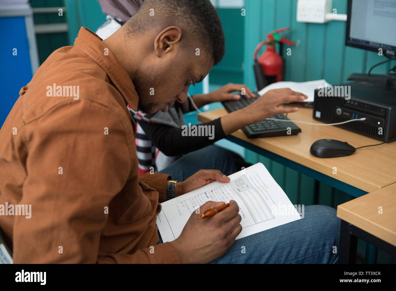 students attending adult education college Stock Photo