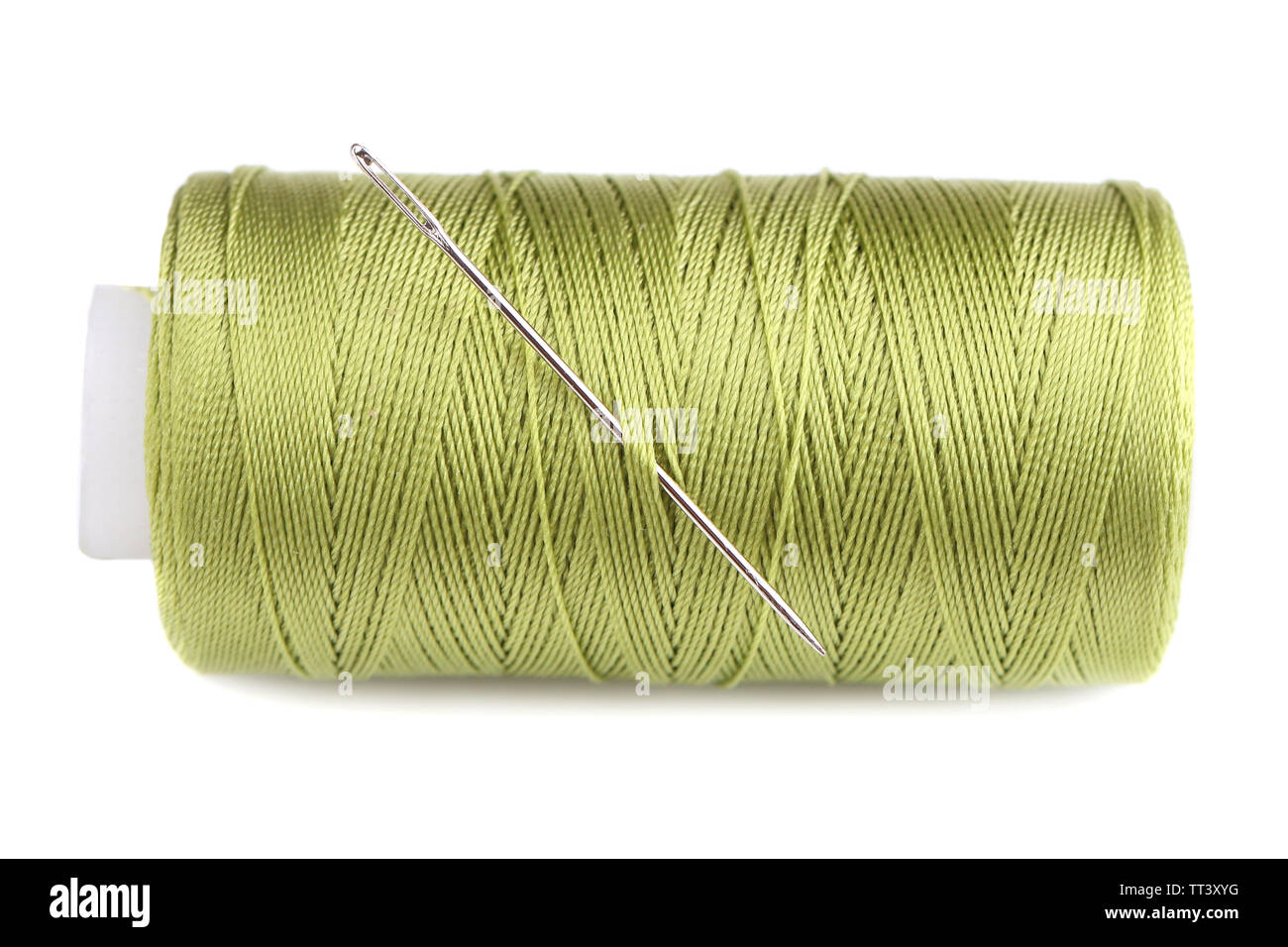 Needle and spool of thread isolated on white Stock Photo - Alamy