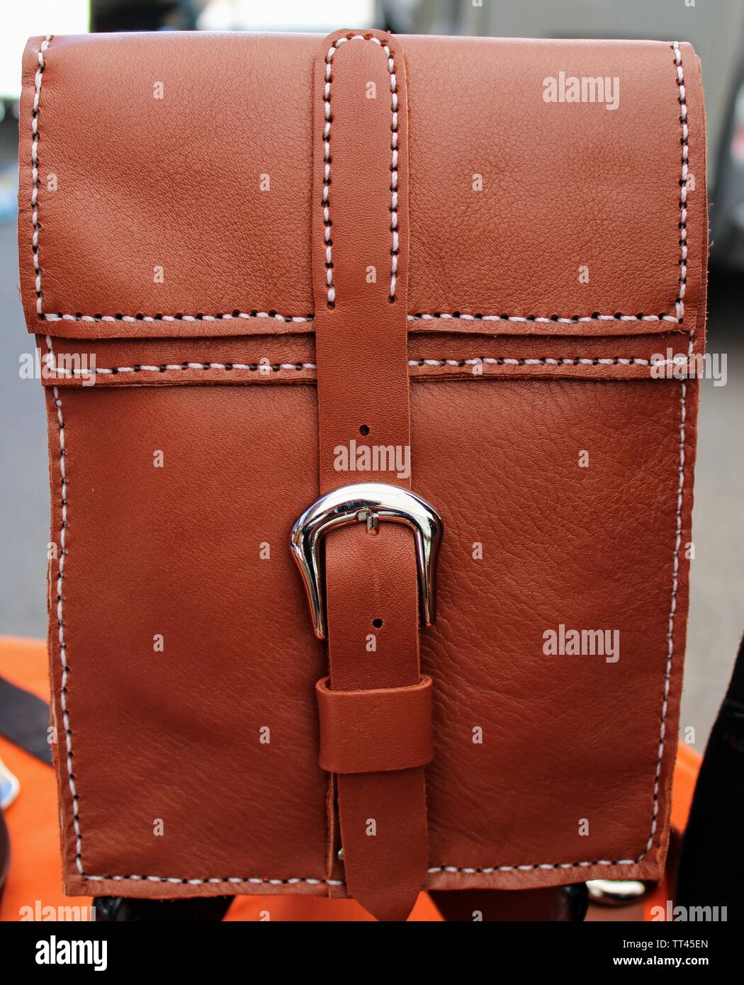 Hand stitched brown leather bag with buckle closure Stock Photo Alamy