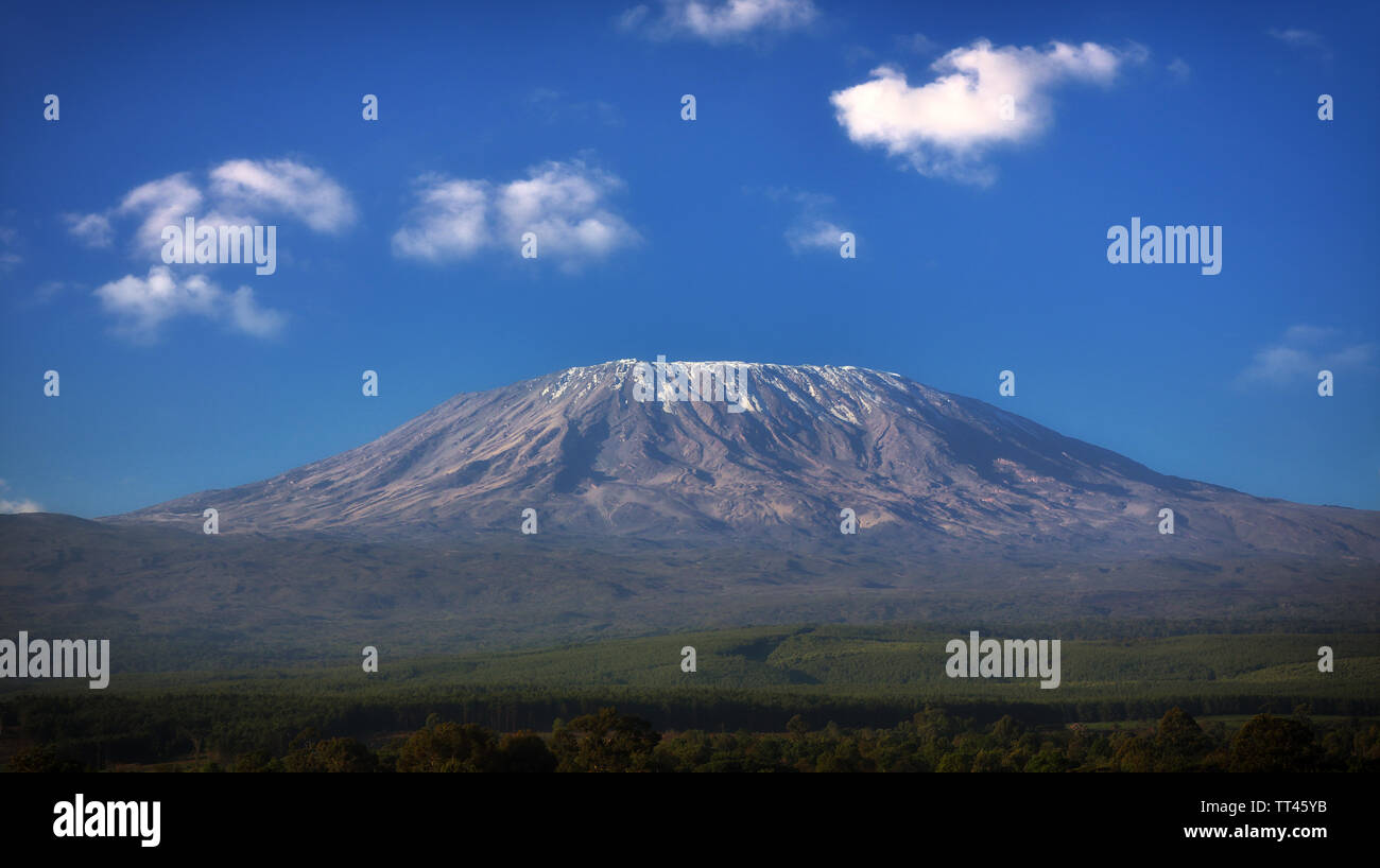 Mount Kilimanjaro with blue sky and clouds, Tanzania Stock Photo