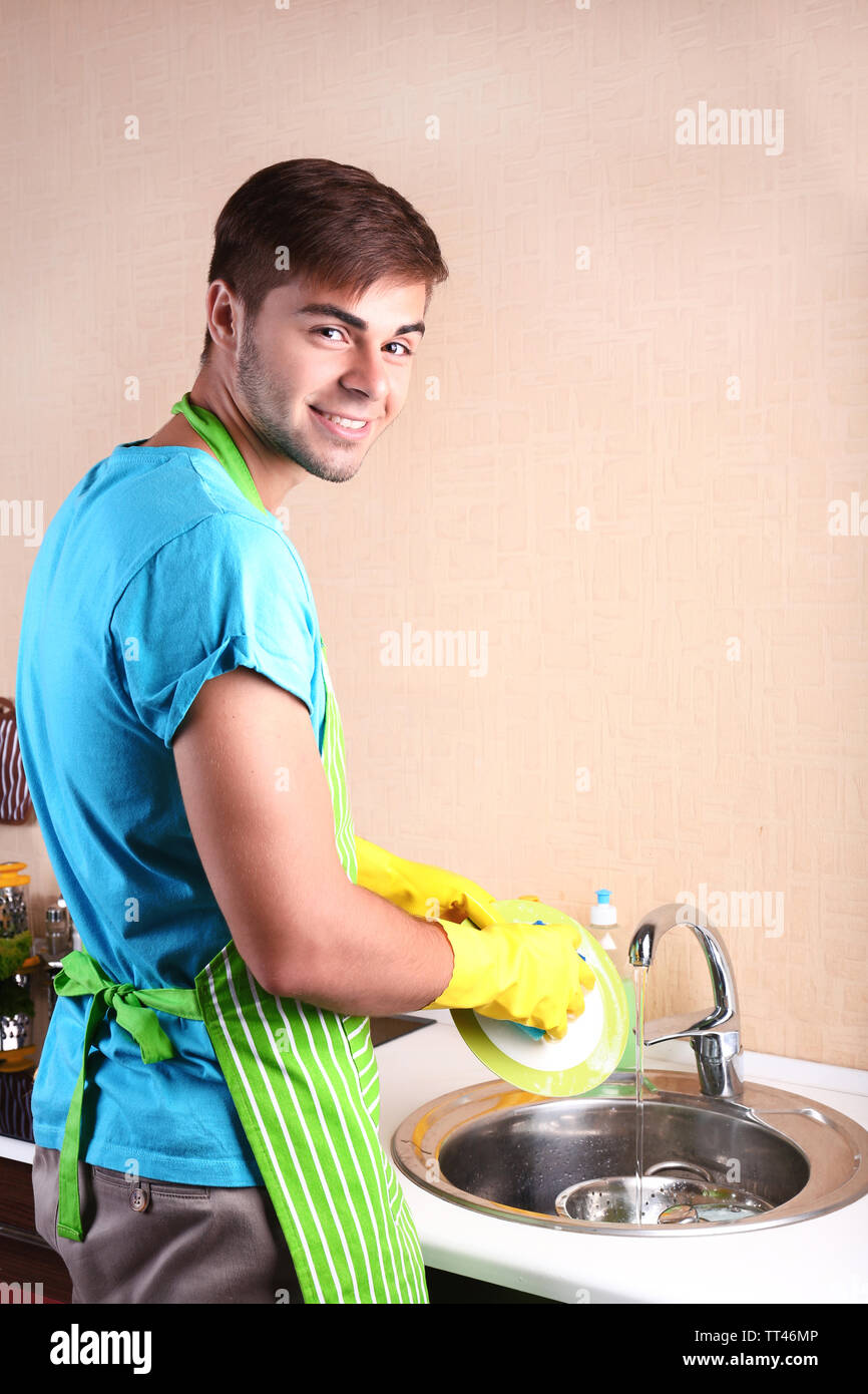 man-washing-dish-in-kitchen-stock-photo-alamy