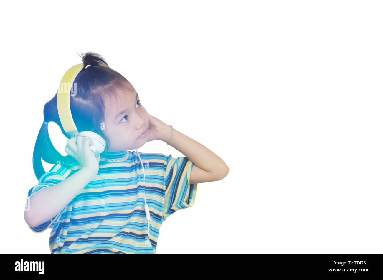 young girl listening music with headphone and sell phone Stock Photo