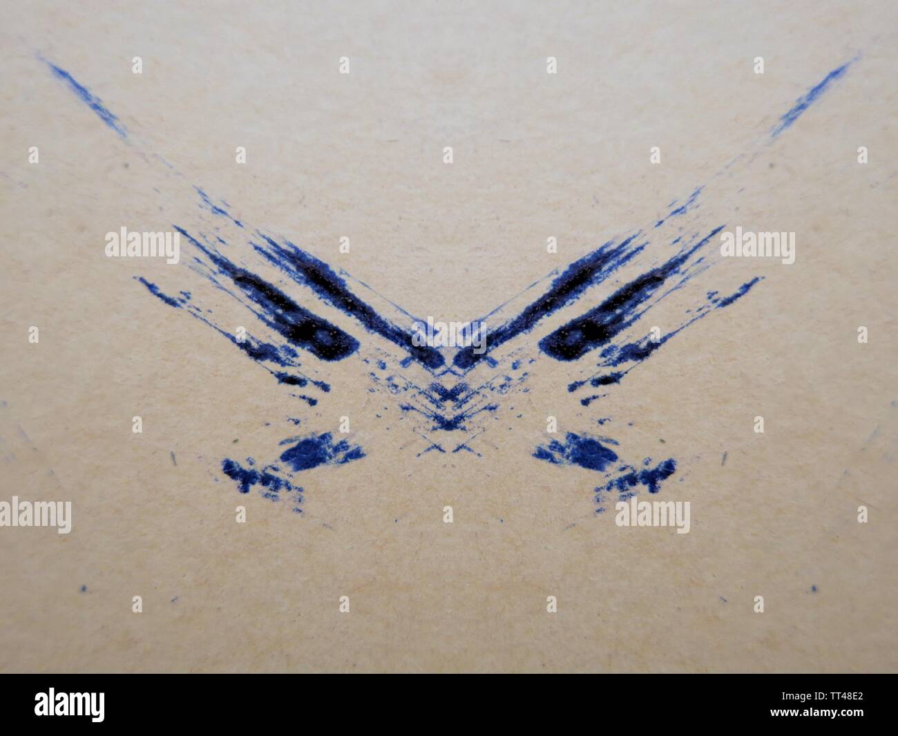 Blue ink smudge on beige paper, abstract Stock Photo Alamy