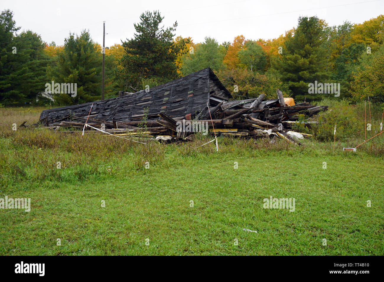 Collapsed log cabin Stock Photo