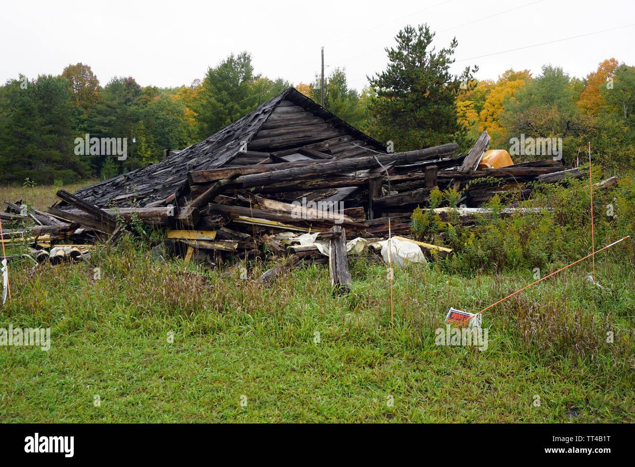 Collapsed log cabin Stock Photo