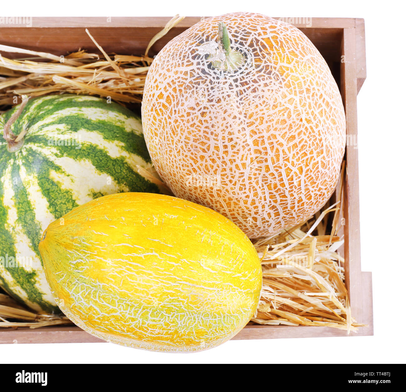 Melons and watermelons in wooden box isolated on white Stock Photo - Alamy