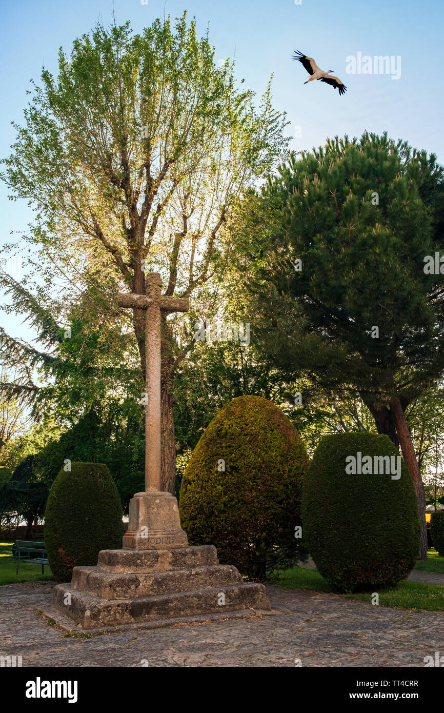 Stone Cross year 1715 in Santuario de Nuestra senora de Sonsoles with stork flying, Avila, Spain, sanctuary Stock Photo