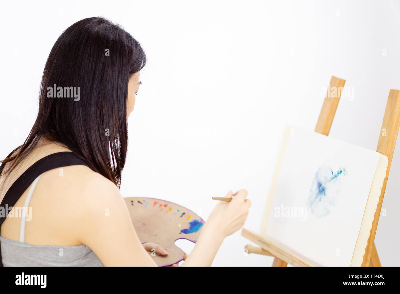 Artist painting oil painting on an easel Stock Photo Alamy