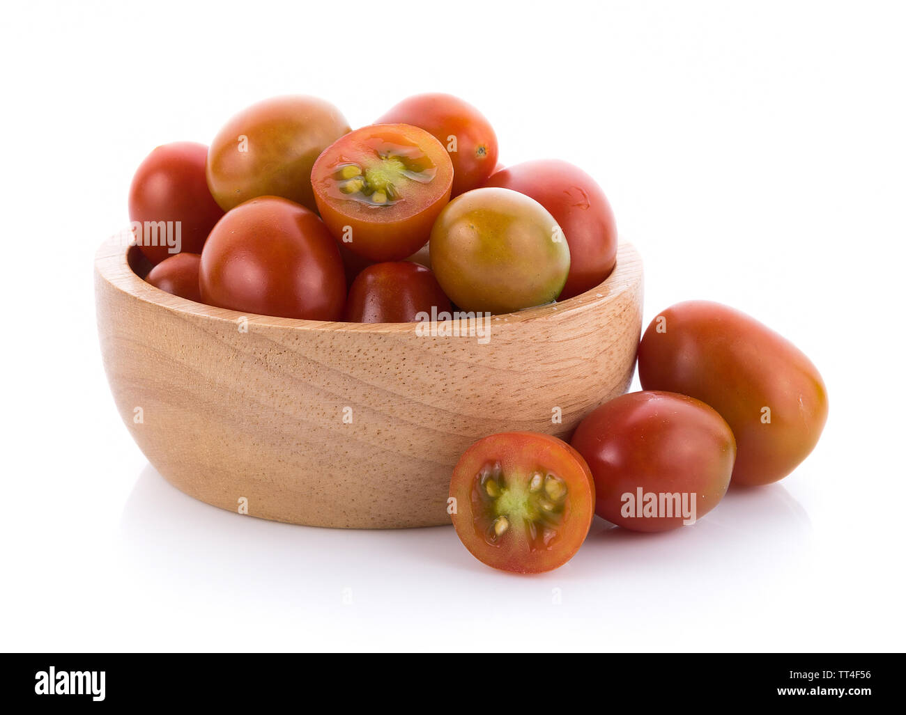 tomato in wooden bowl on white background Stock Photo - Alamy