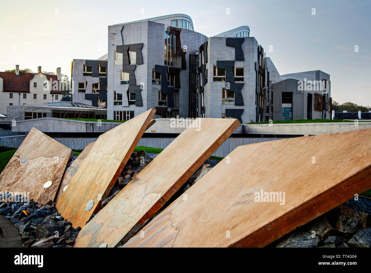 Slabs illustrating the geological stratum of United Kingdom at the entrance to Dynamic Earth in Edinburgh with the Holyrood Scottish Parliament buildi Stock Photo