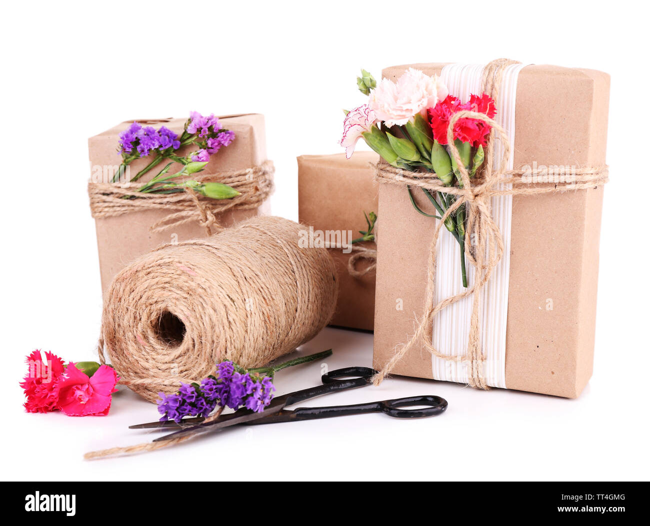 Beautiful gifts with flowers and decorative rope, isolated on white ...