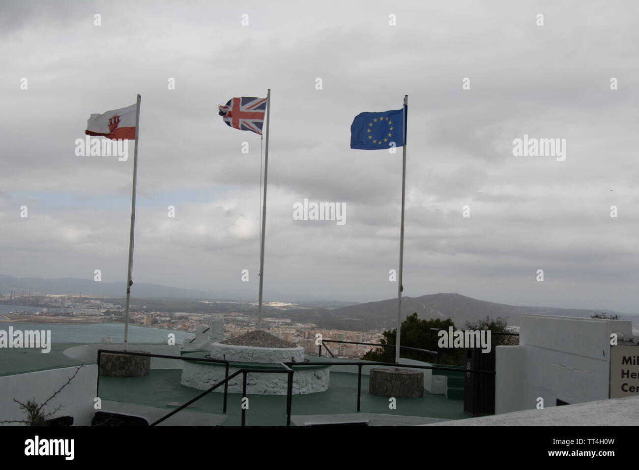 flags on the top of Gibraltar rock flying high view views wind windy