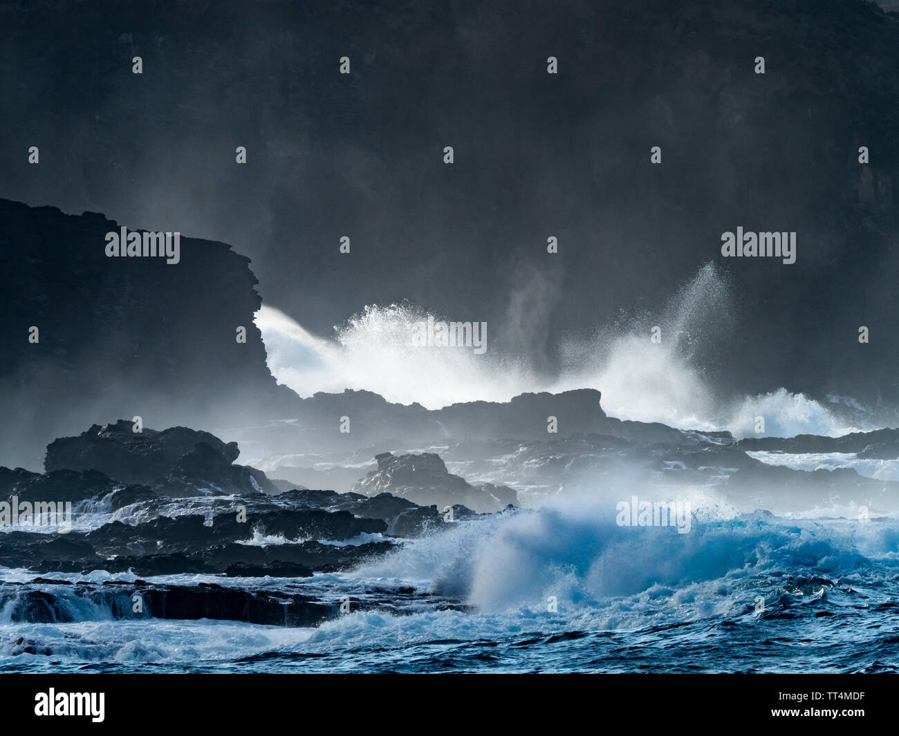 Waves crashing on the dramatic coastline of Ua Huka Island, Marquesas, French Polynesia Stock Photo
