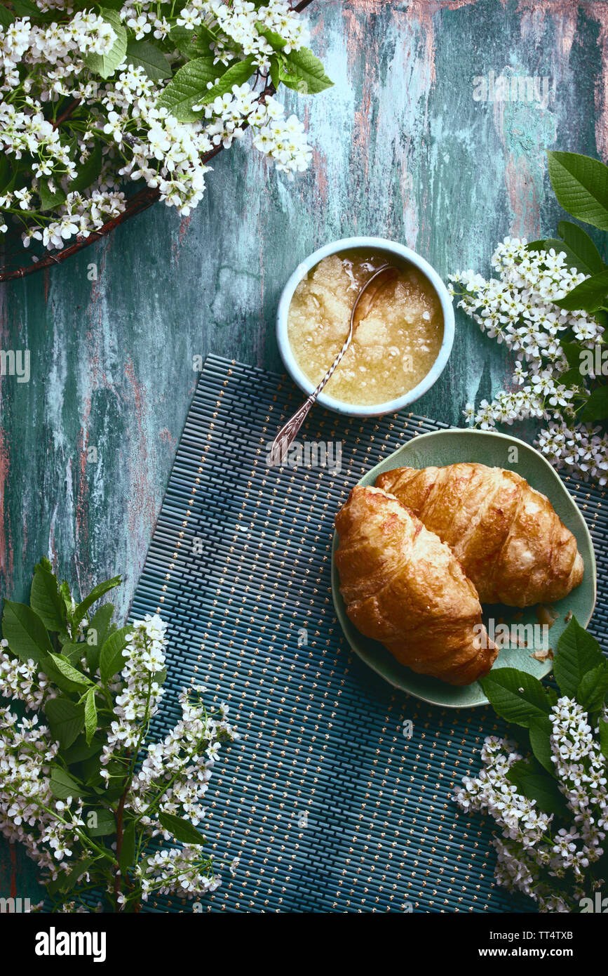 flatlay food background - empty wooden board with croissants and honey, with copy space for text Stock Photo