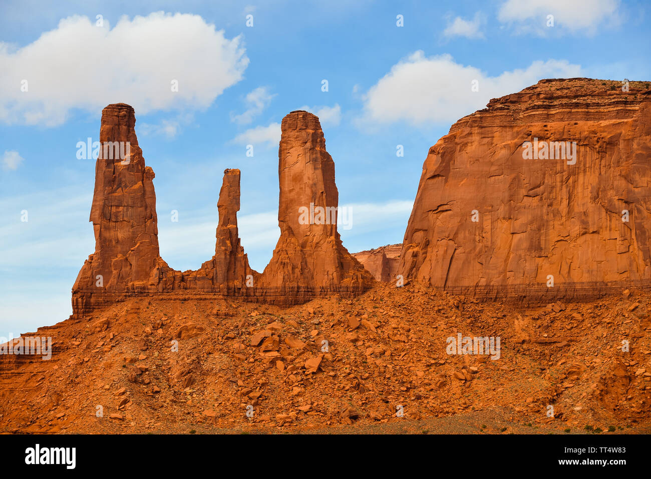 Three Sisters Rock Formation, Monument Valley -  Navajo Tribal Park, AZ Stock Photo
