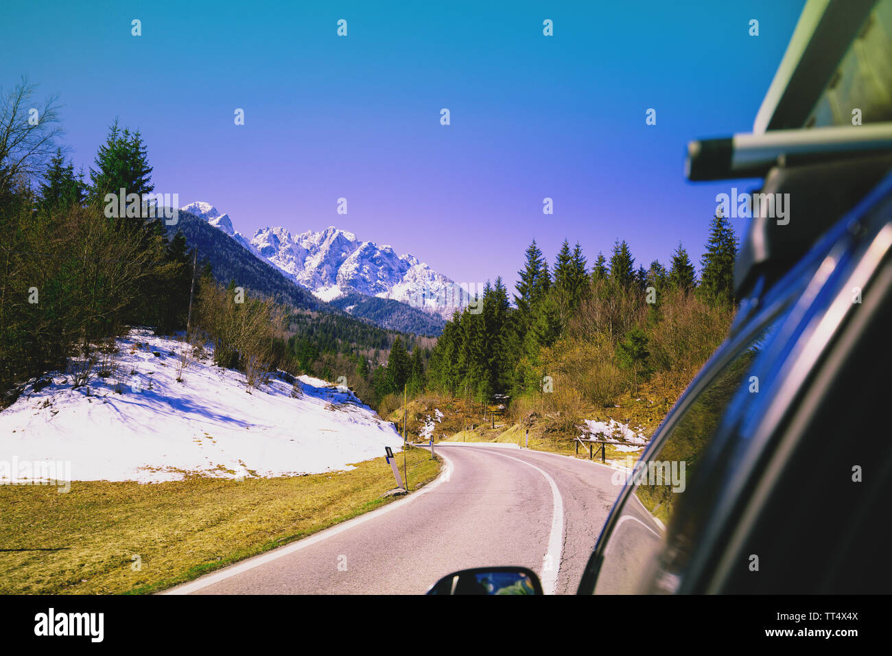 Driving a car on mountain winding road Stock Photo - Alamy