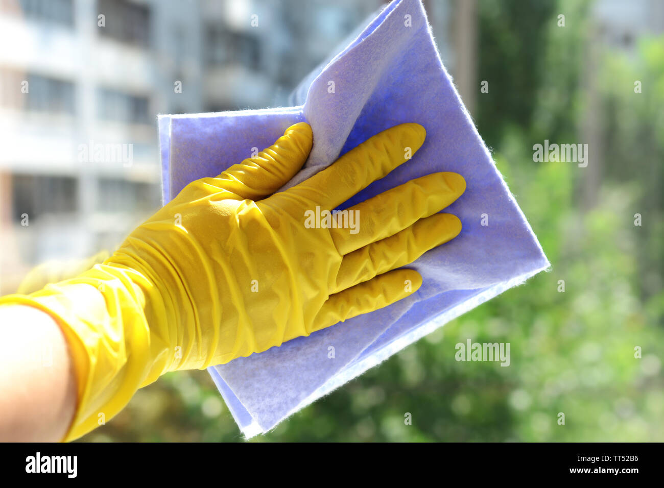 Cleaning windows with special rag Stock Photo - Alamy