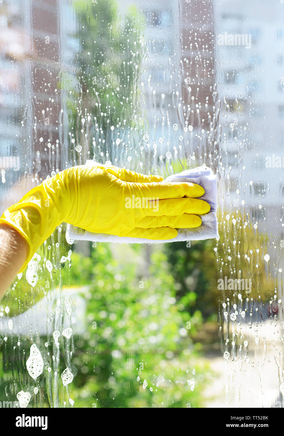 Cleaning windows with special rag Stock Photo - Alamy