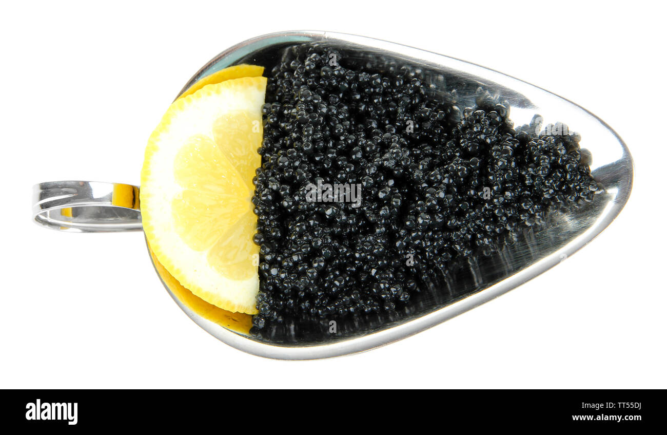 Black caviar and slice of lemon in metal dish isolated on white Stock Photo