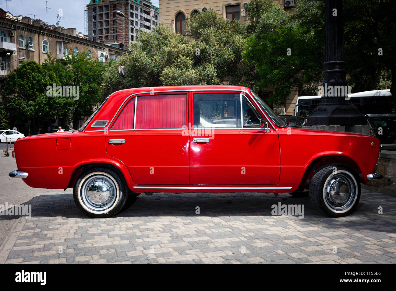 A new bright red Lada motor vehicle parked in Central Baku, Azerbaijan Stock Photo
