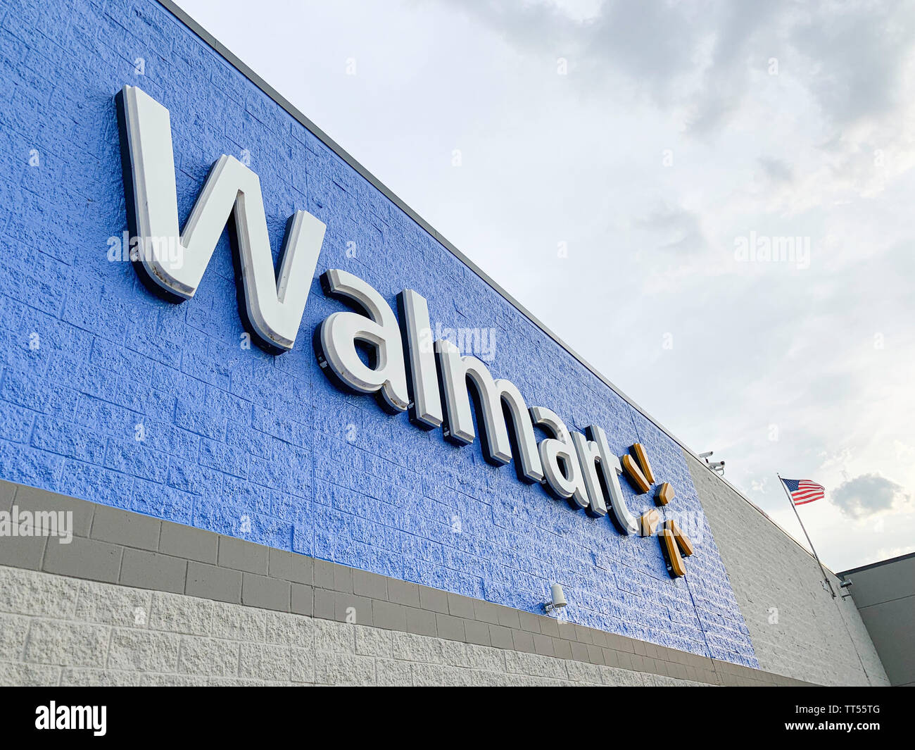 The prominent lighted 3D plastic sign of the Walmart Superstore located in Vidalia, Georgia, USA, is featured on the facade. Stock Photo