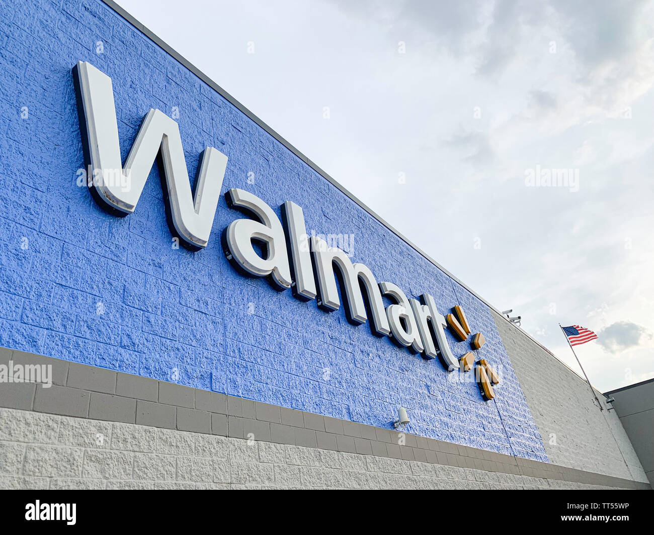 The prominent lighted 3D plastic sign of the Walmart Superstore located in Vidalia, Georgia, USA, is featured on the facade. Stock Photo
