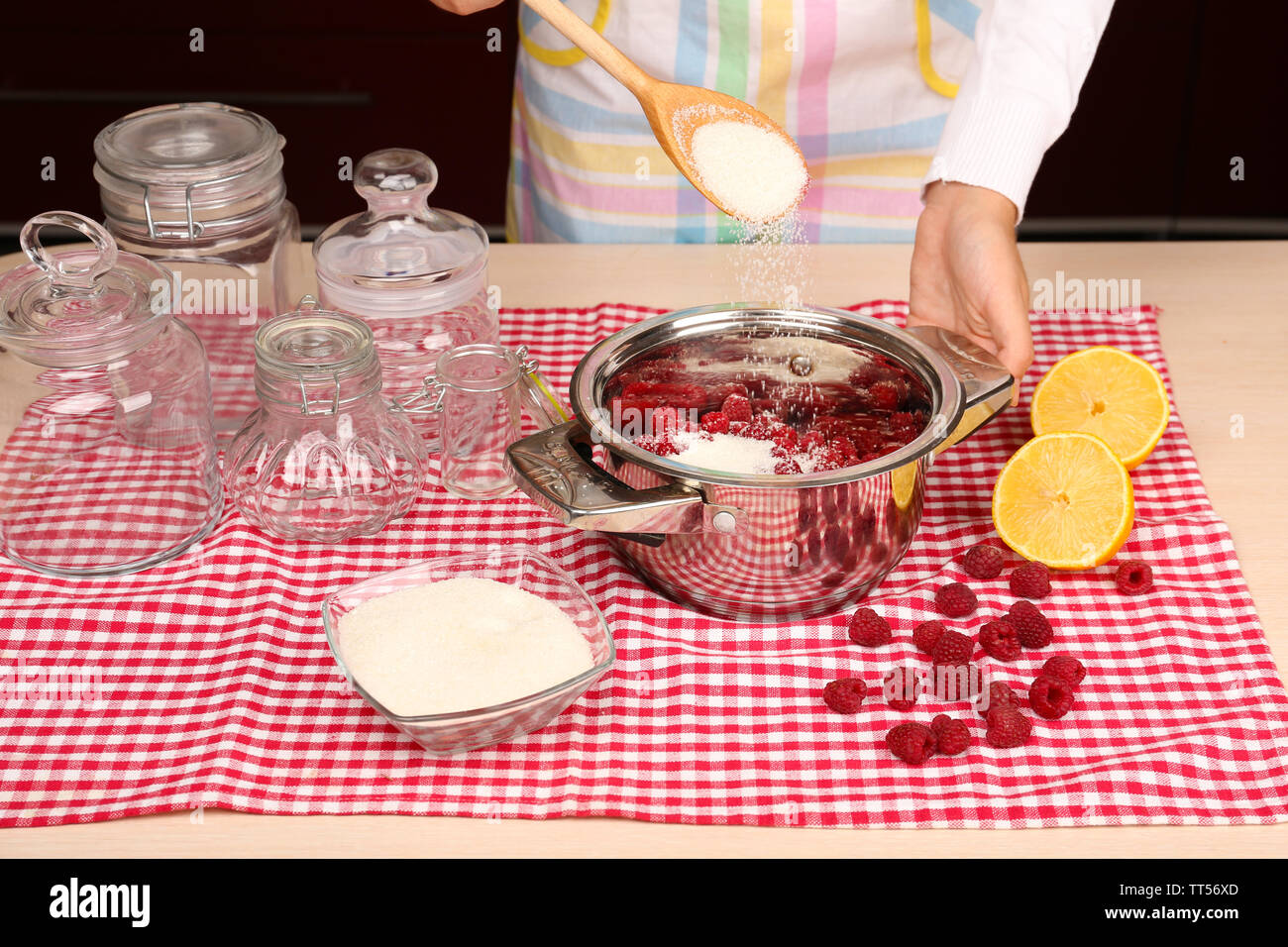 Land Cookery Raspberry Jam Woman cooking raspberry jam in kitchen Stock Photo - Alamy