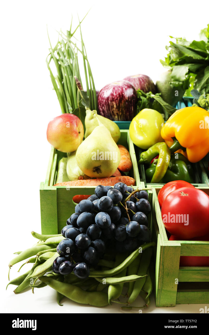Fresh organic vegetables and fruits in wooden boxes, isolated on white ...