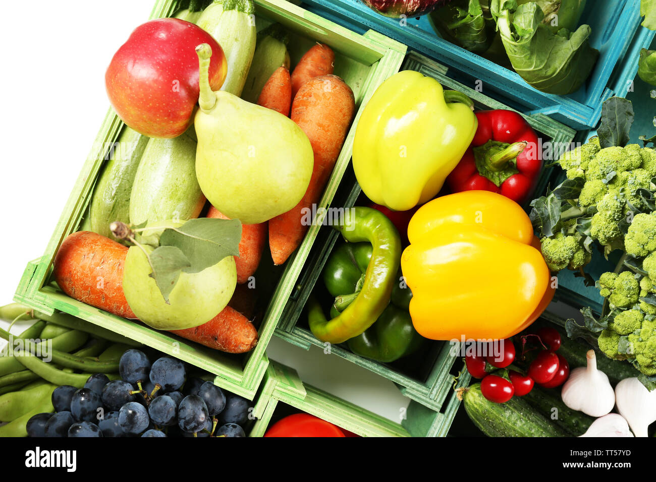 Fresh organic vegetables and fruits in wooden boxes, close up Stock ...