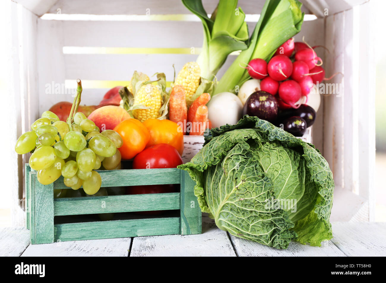 Vegetables in wooden boxes on white wooden box background Stock Photo Alamy
