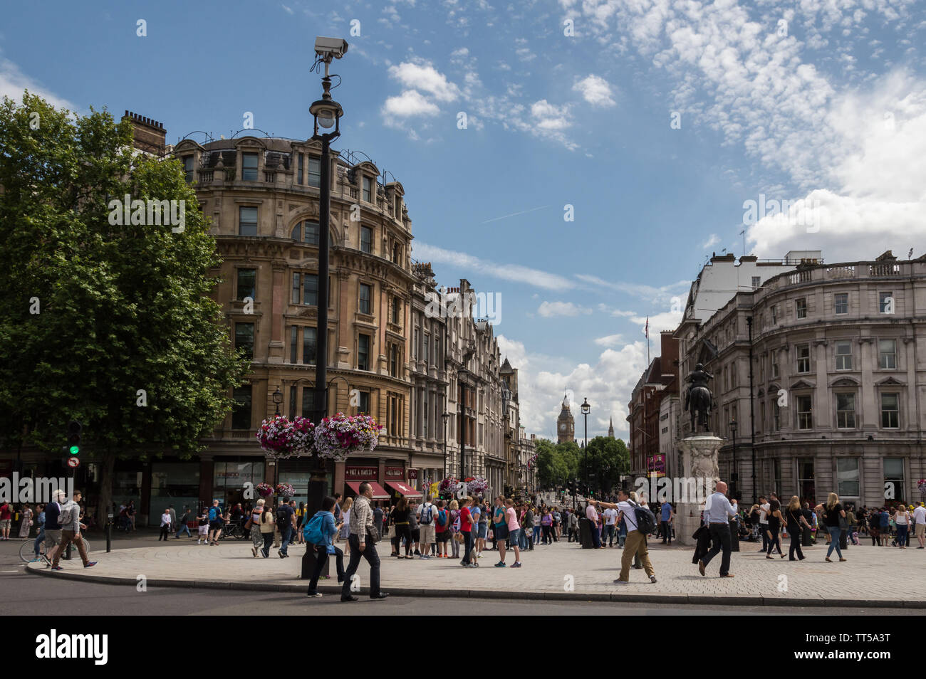 London - July 6th 2014: Big Ben view from Trafalgar square, crowded with tourists Stock Photo