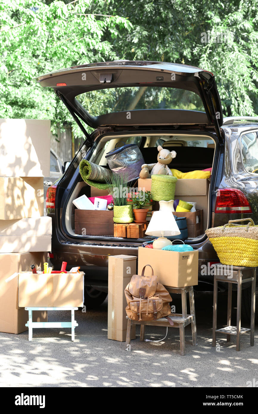 Moving boxes and suitcases in trunk of car, outdoors Stock Photo Alamy
