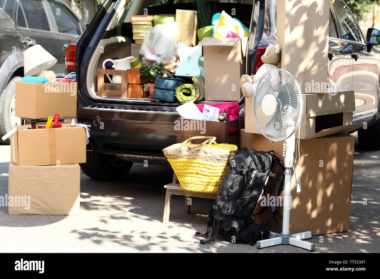 Moving boxes and suitcases in trunk of car, outdoors Stock Photo Alamy