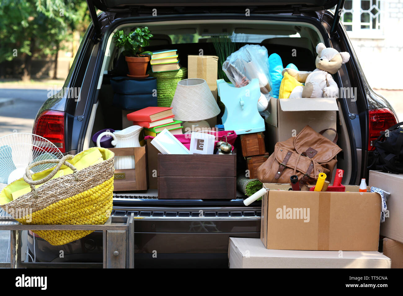 Moving boxes and suitcases in trunk of car, outdoors Stock Photo Alamy