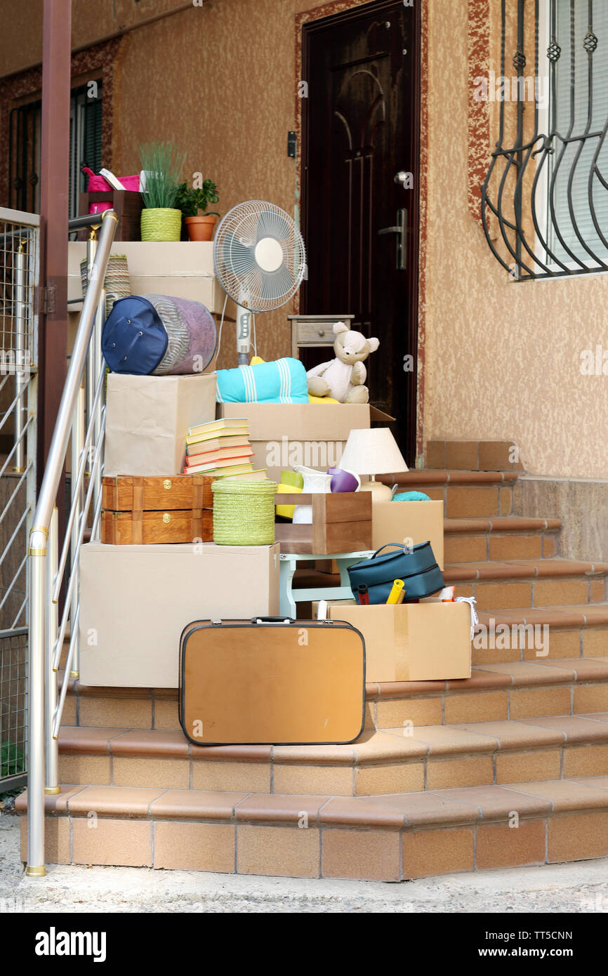 Moving boxes on stairs of new house, outdoors Stock Photo Alamy