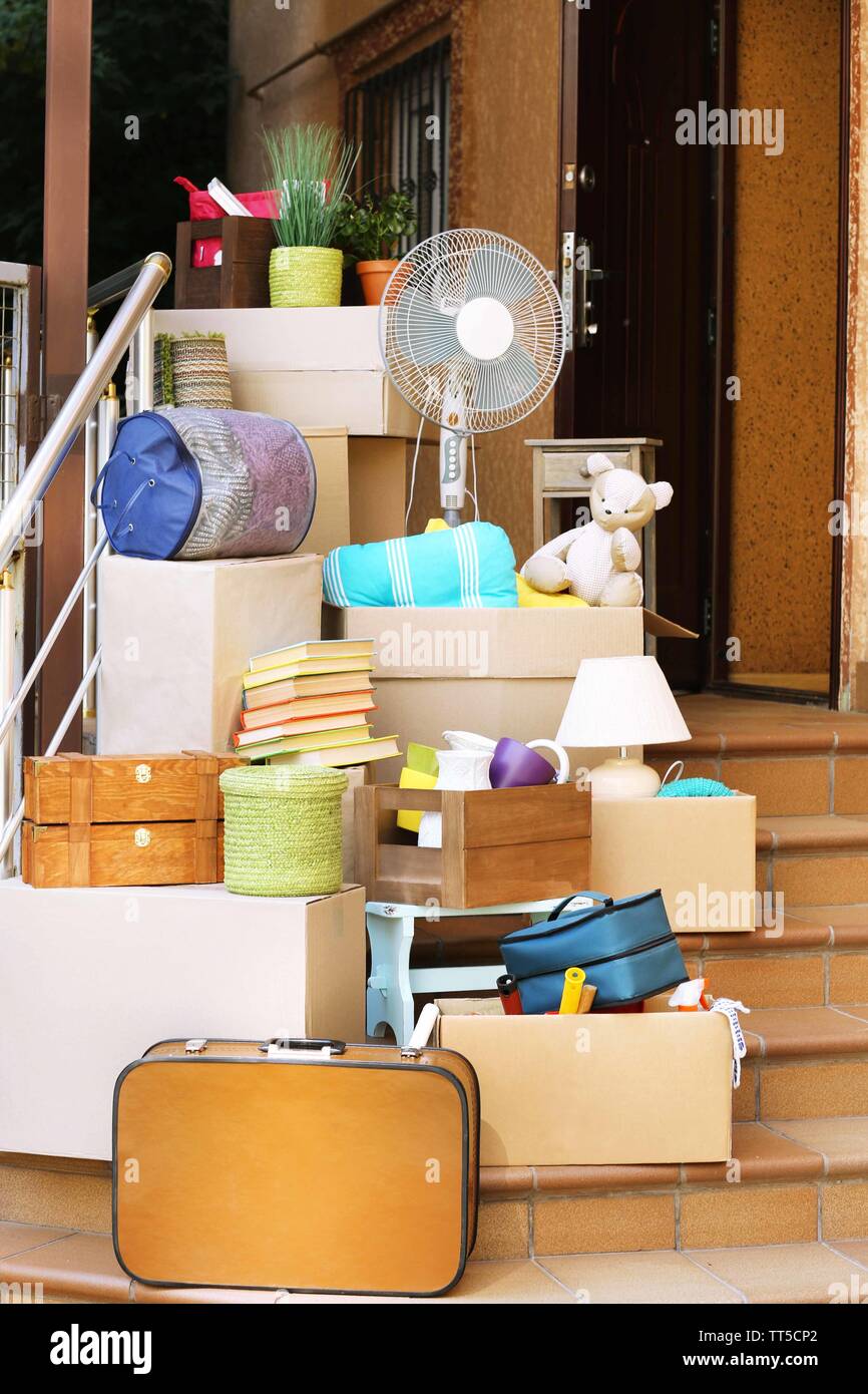 Moving boxes on stairs of new house, outdoors Stock Photo Alamy