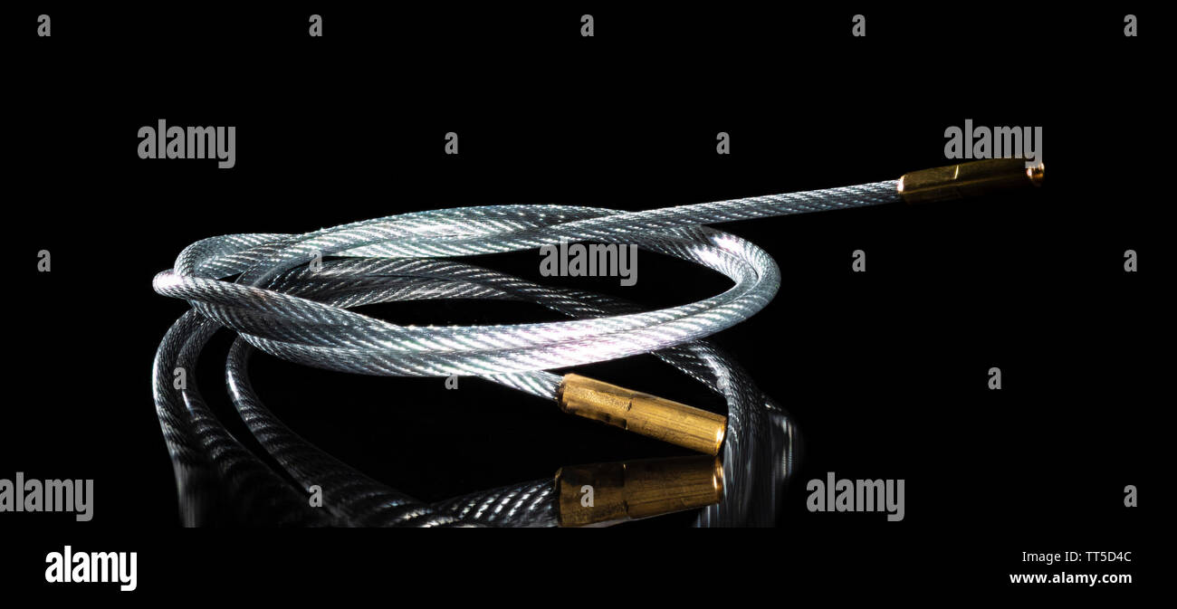 Long steel cable that is designed to clean guns Stock Photo Alamy