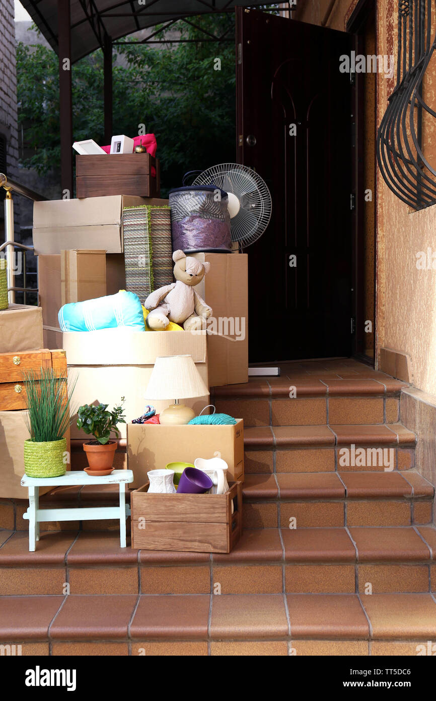 Moving boxes on stairs of new house, outdoors Stock Photo Alamy