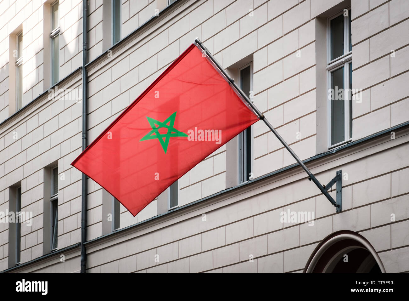 morocco flag - moroccan flag on pole on building - Stock Photo
