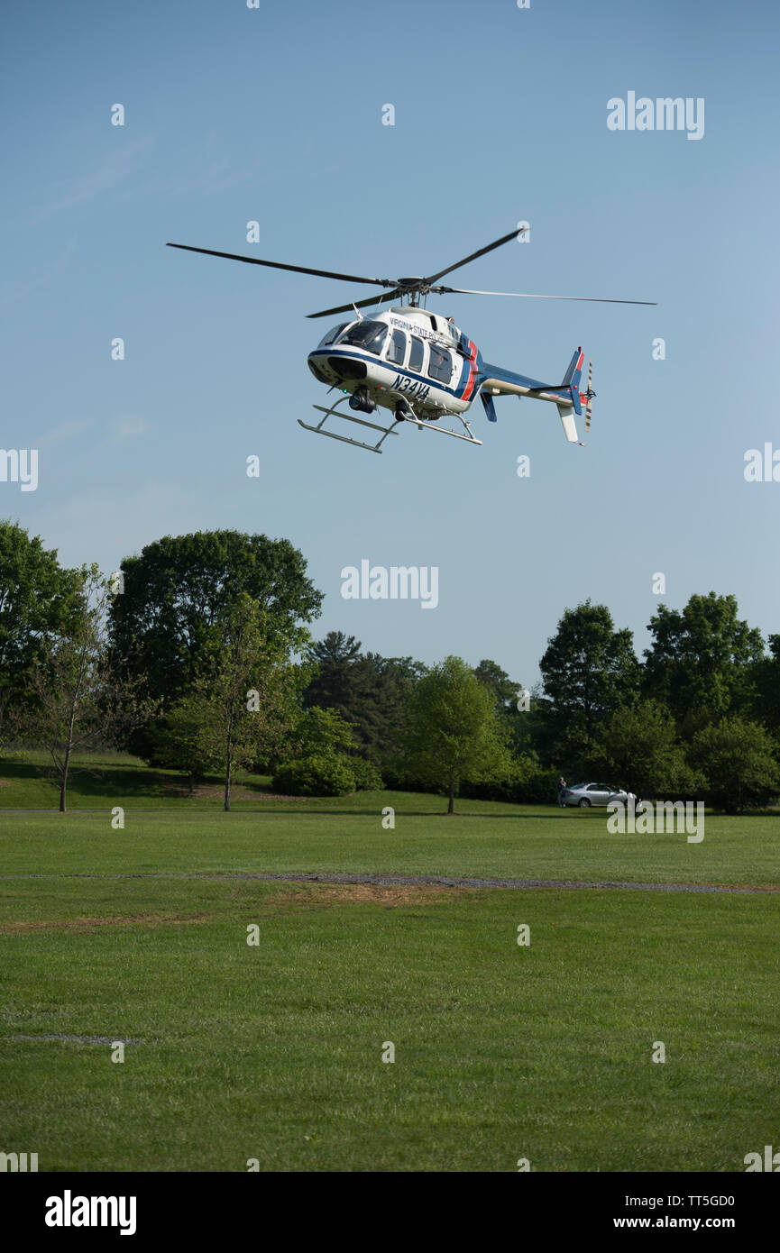 UNITED STATES - May 24, 2016: Governor Terry McAuliffe arrives in a Virginia State Police helicopter at Blandy Experimental Farm in Boyce Virginia tod Stock Photo