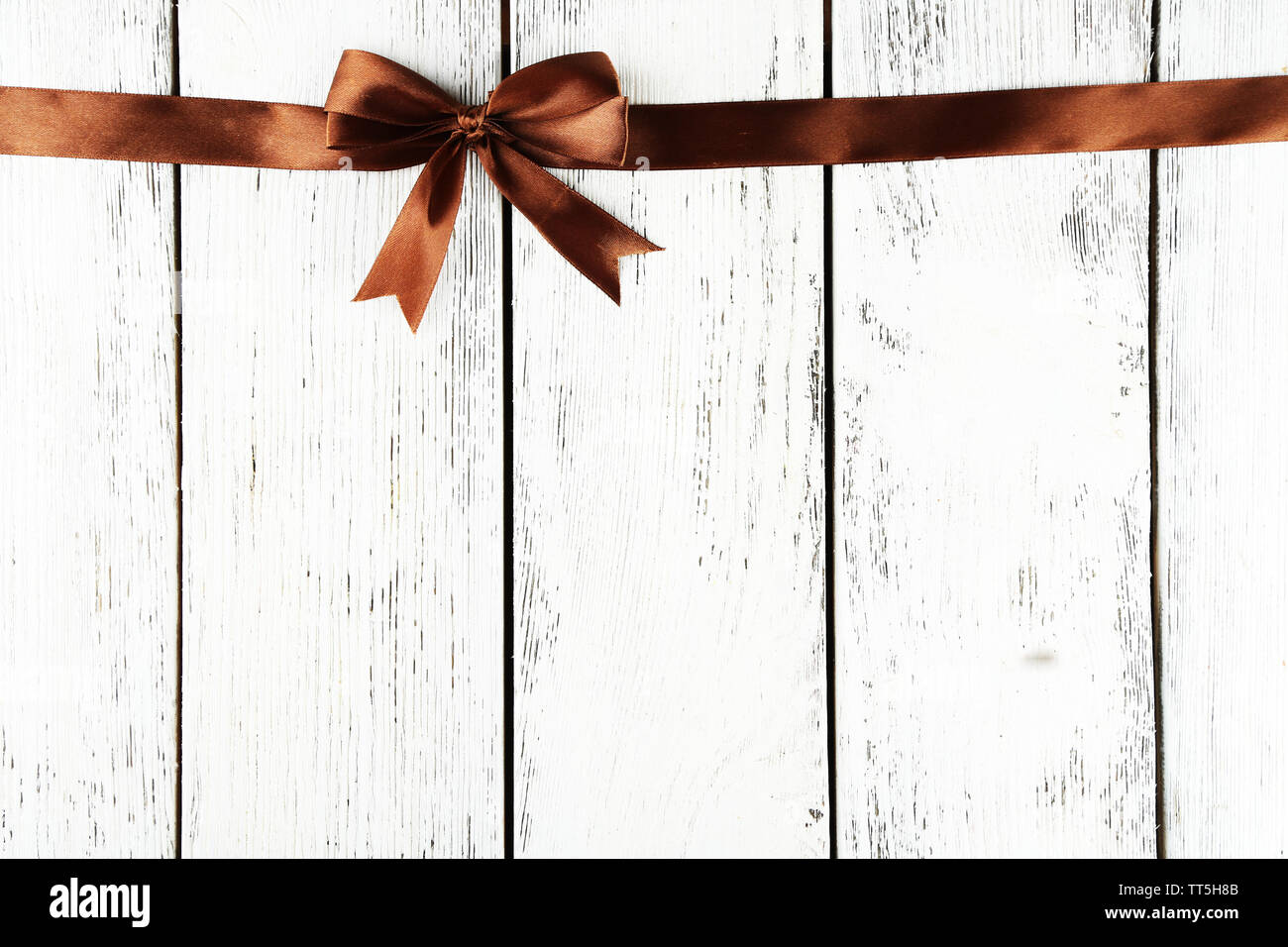 Old wooden background with beautiful bow Stock Photo - Alamy