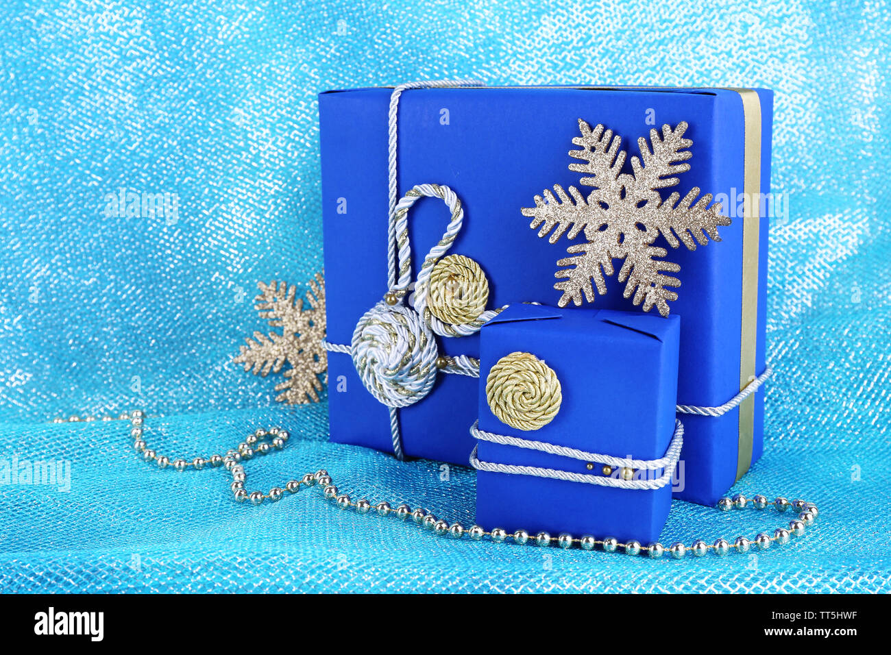 Dark blue gift boxes on blue fabric background Stock Photo Alamy