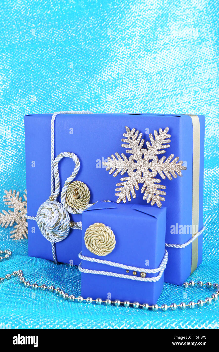 Dark blue gift boxes on blue fabric background Stock Photo Alamy