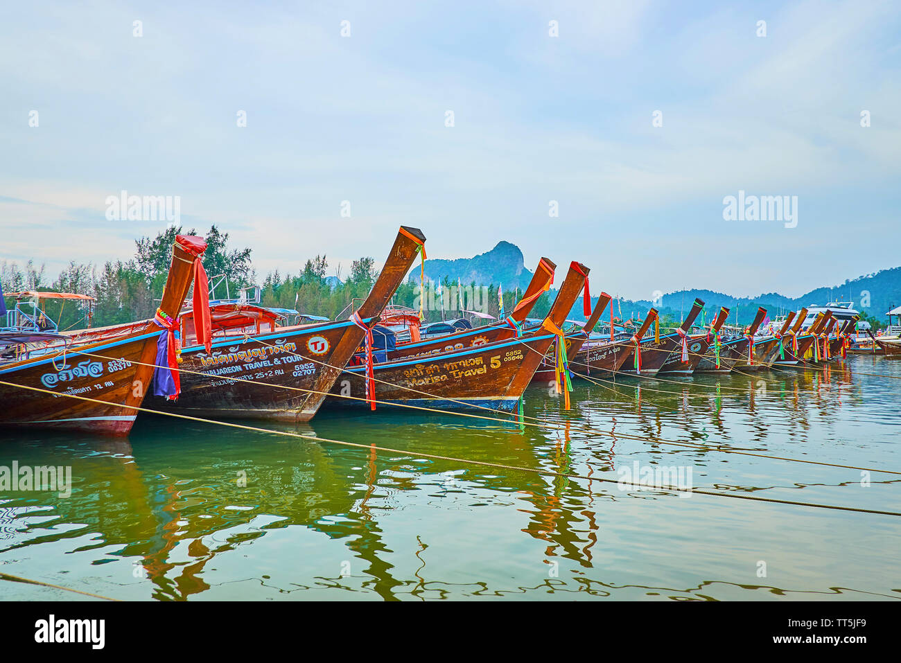 AO NANG, THAILAND - APRIL 27, 2019: The line of longtail boats are moored along the bank of Klong Son canal in Noppharat Thara National Park, on April Stock Photo