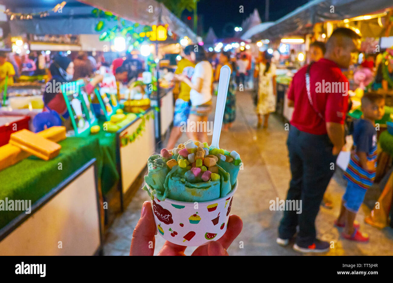 AO NANG, THAILAND - APRIL 27, 2019: Traditional ice rolls (dondurma) is one of the best cool desserts, can be offered in Ao Nang Night Market, on Apri Stock Photo