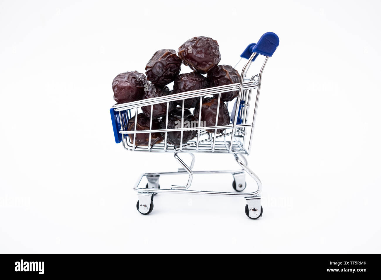 Dates fruit in market cart, concept of stocks, price or date fruit trade Stock Photo