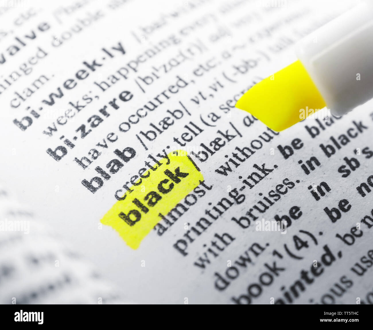 Yellow marker highlighting word in dictionary Stock Photo Alamy